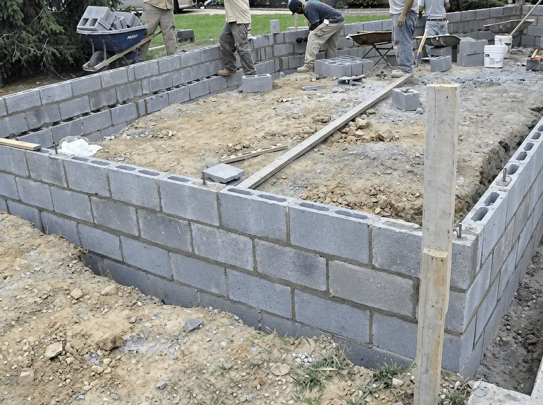 Professionals building a foundation with blocks in El Paso, TX