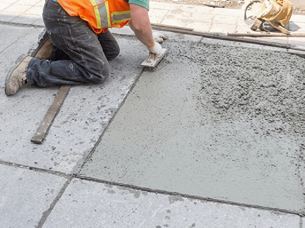Professional repairing a concrete floor in El Paso, TX